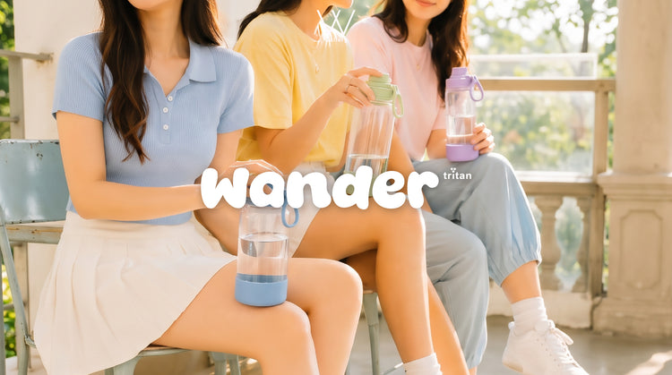 Friends holding pastel water bottles